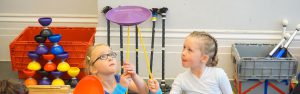 Young theatre school pupils do plate spinning